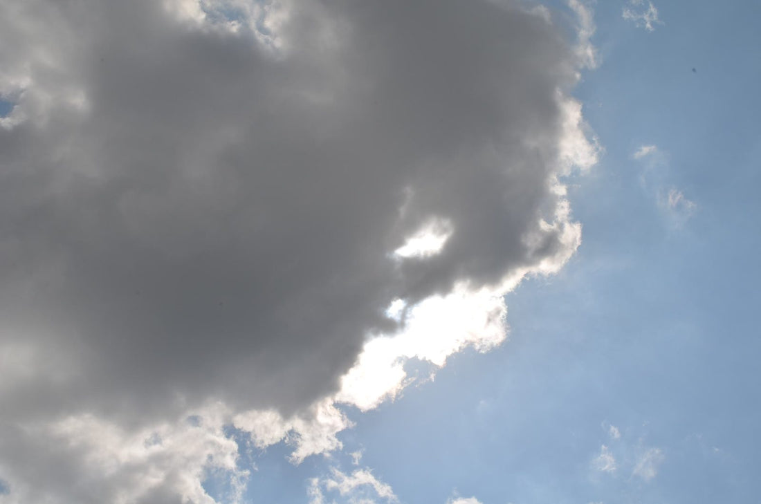 Thick cloud drifting across the sun in a blue sky during a solar bake